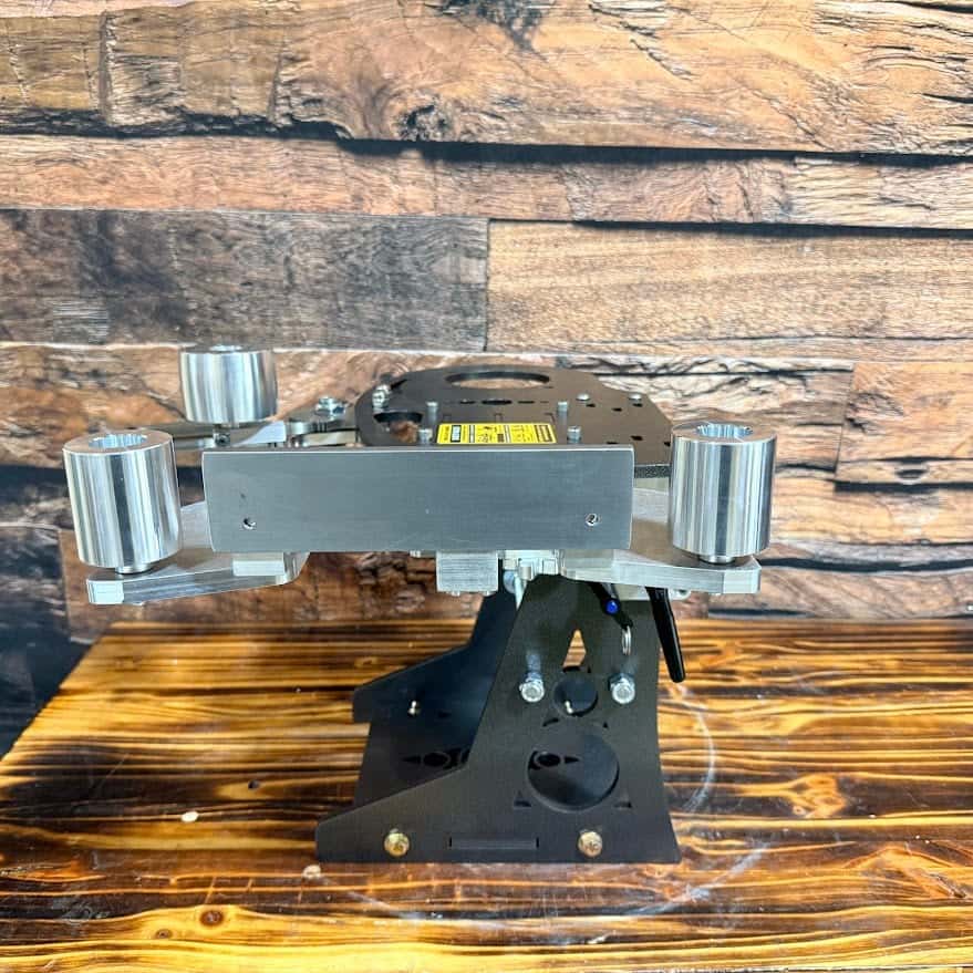 Nebula grinder in the horizontal position, showing its steel frame and aluminum platen assembly